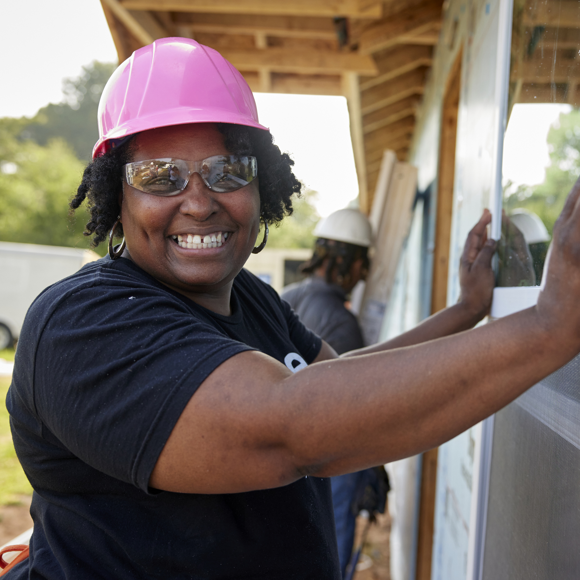 Woman volunteering on a Habitat for Humanity build site