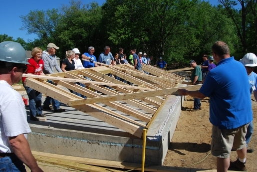 Group of volunteers working on new build